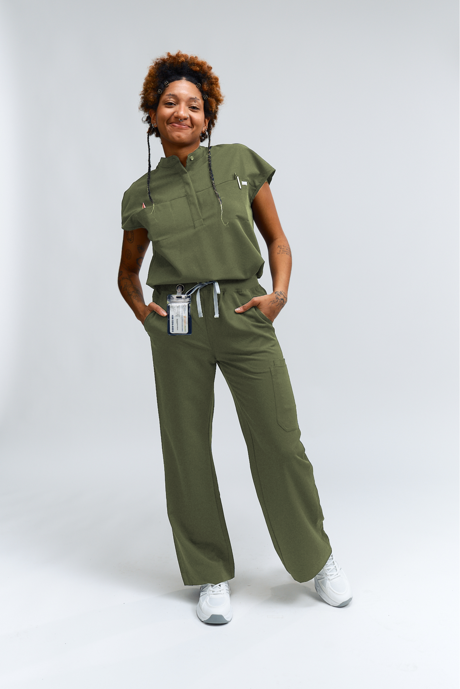 Person wearing a green outfit with a white background